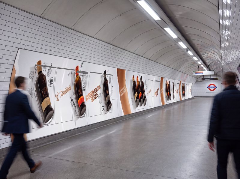 Glenfiddich Experimental Series corridor takeover at King’s Cross St Pancras Underground station, with large-format bottle panels along the tunnel wall